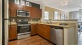 large, c-shaped kitchen with ample lighting