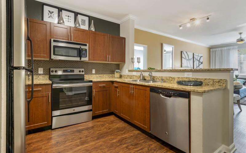 large, c-shaped kitchen with ample lighting