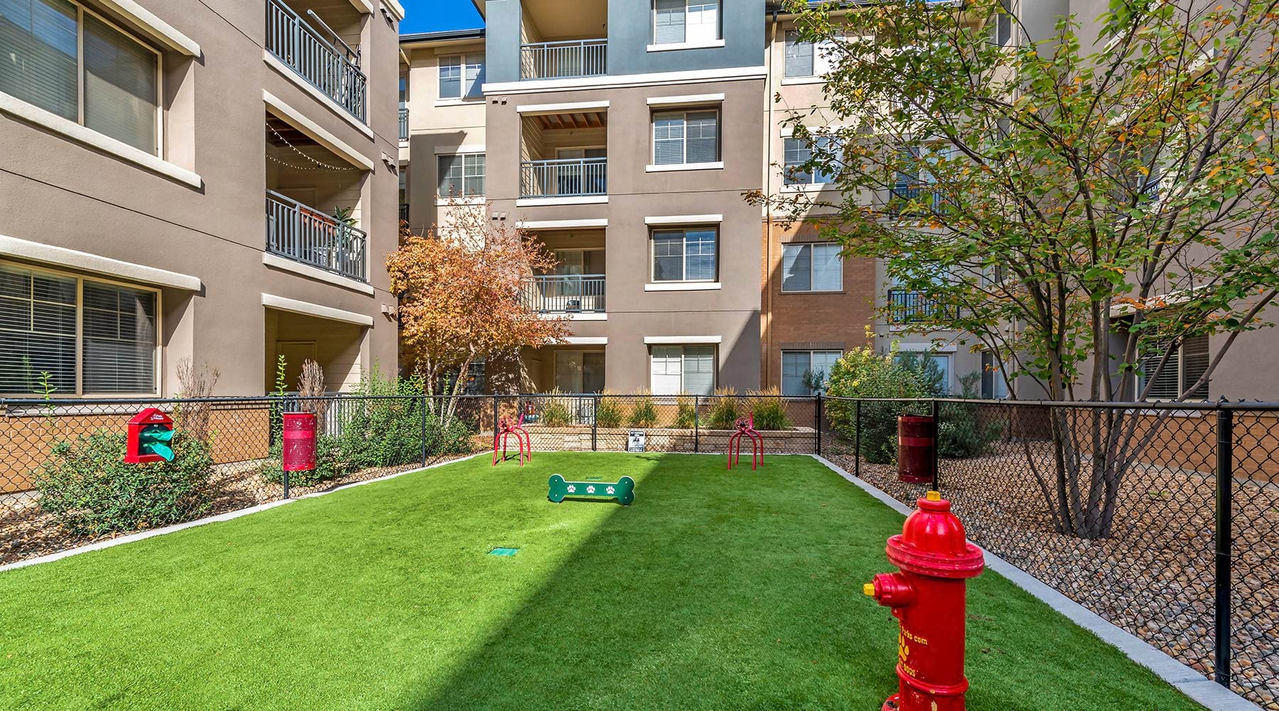We're a pet-friendly community dog park in a courtyard with a red fire hydrant