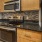 well lit kitchen with black appliances
