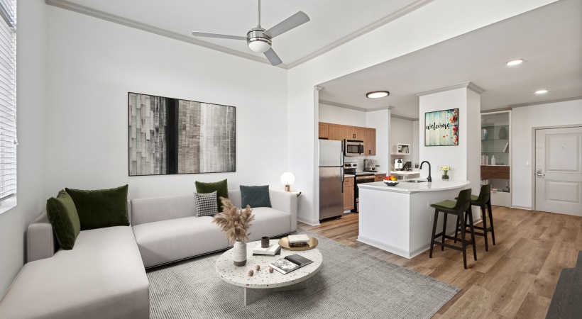 open-concept apartment living area with ceiling fan