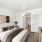 apartment bedroom with large closet and bright lighting