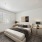 apartment bedroom with ample space and bright lighting