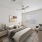 spacious apartment bedroom with ceiling fan