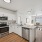c-shaped kitchen with open floor plan to large living room