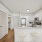 open kitchen with granite countertops and modern finishes