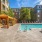 cabanas alongside outdoor swimming pool