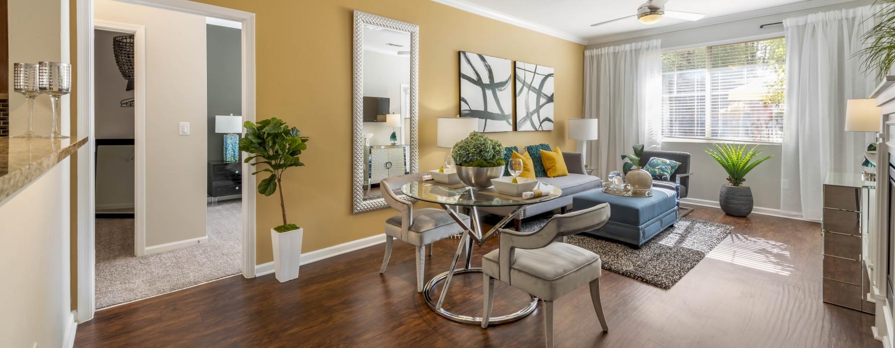 spacious living room and dining area full of natural lighting