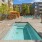 jacuzzi next to swimming pool